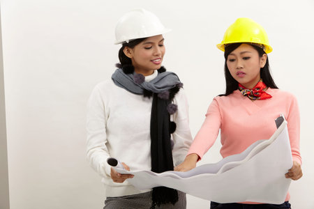 women with helmet holding blue printの写真素材