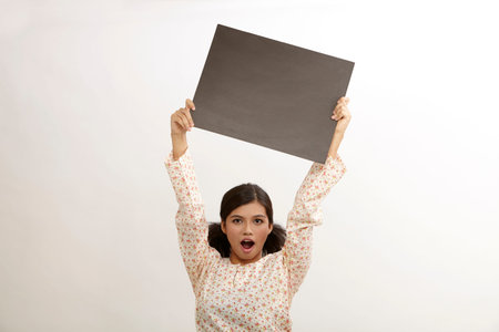 malay woman a holding placardの写真素材