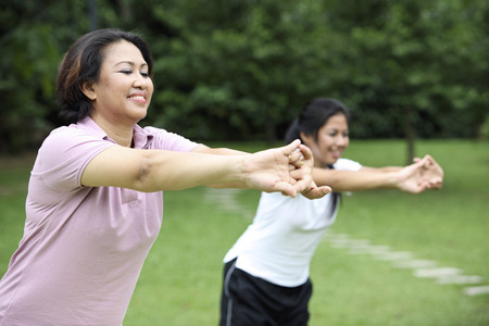 Mother and daughter exercise togetherの写真素材