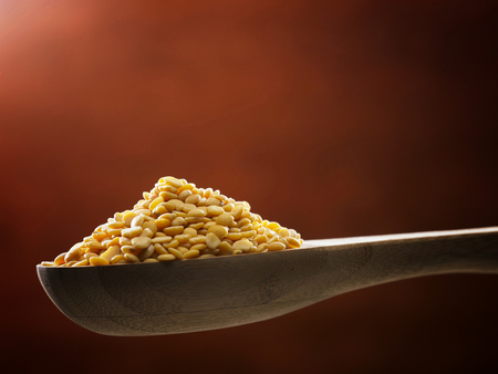 spoon full of yellow split peasの写真素材