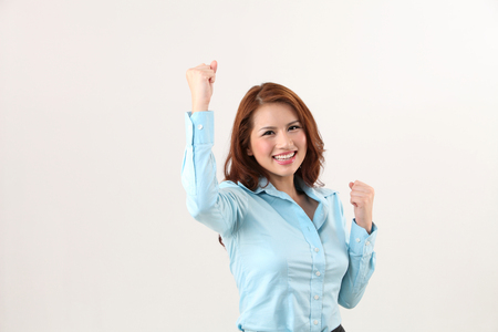 office lady  with arm raising cheerfulの写真素材