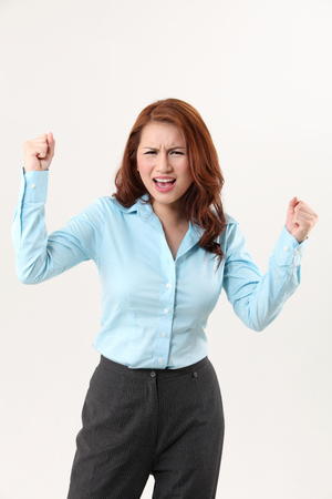office lady  with arm raising-angryの写真素材