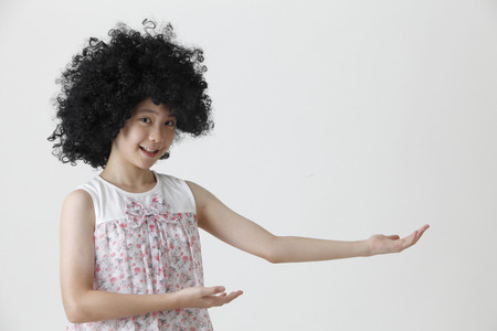 chinese girl wearing a big black wigの写真素材