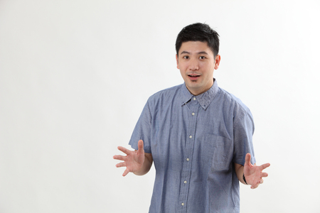 Mature chinese man with surprise expressionの写真素材