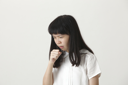 chinese girl not well,coughingの写真素材