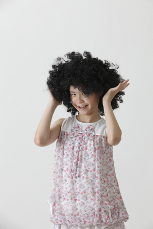 chinese girl wearing a big black wigの写真素材