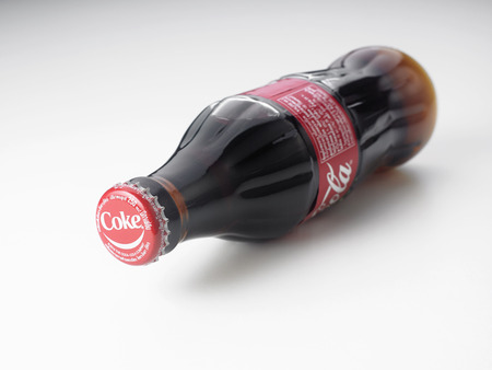 KUALA LUMPUR, MALAYSIA - June 6TH, 2015. A bottle of Coca Cola soft drinks. Coca Cola drinks are produced and manufactured by The Coca-Cola Company, an American multinational beverage corporationのeditorial素材