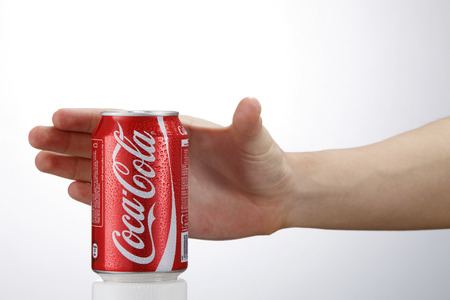 Kuala Lumpur,Malaysia 9th April 2015, hand holding a red Coca Cola can drinks.Coca Cola drinks are produced and manufactured by The Coca-Cola Companyのeditorial素材