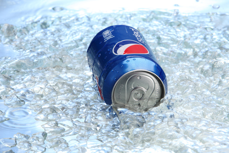 kuala Lumpur,Malaysia 15th April 2015,Can of Pepsi cola on a bed of ice and white background, Pepsi is a carbonated soft drink produced PepsiCo. Created in 1893のeditorial素材