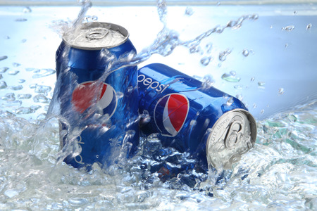 kuala Lumpur,Malaysia 15th April 2015,Can of Pepsi cola on a bed of ice and white background, Pepsi is a carbonated soft drink produced PepsiCo. Created in 1893のeditorial素材