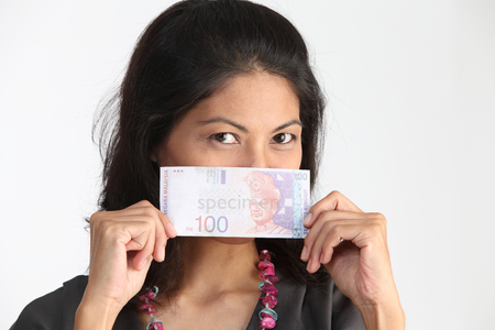 malay woman holding one hundred malaysia currencyのeditorial素材