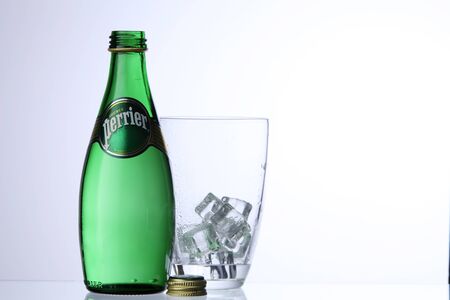 KUALA LUMPUR, MALAYSIA - Feb 17, 2016 perrier drinking water with glass with ice cubeのeditorial素材