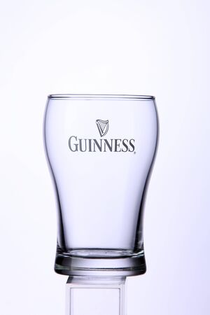 KUALA LUMPUR, MALAYSIA - Feb 15, 2016 empty guinness stout glass on the  white backgroundのeditorial素材