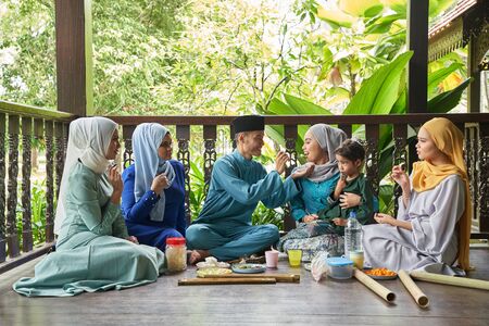 group of malay family breaking the fast togetherの写真素材