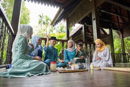 group of malay family breaking the fast togetherの写真素材