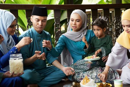 group of malay family breaking the fast togetherの写真素材