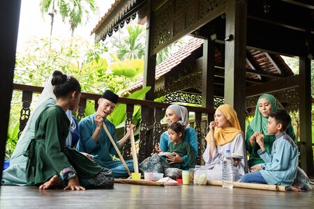 group of malay family breaking the fast togetherの写真素材