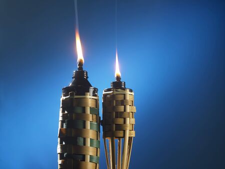bamboo torch or pelita icon of hari raya on blue backgroundの写真素材