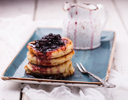 Cottage cheese pancakes with blueberry jam.selective focusの写真素材
