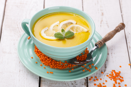 Puree soup with red lentils, with mint and lemon wedges.Traditional Turkish cuisine.の写真素材