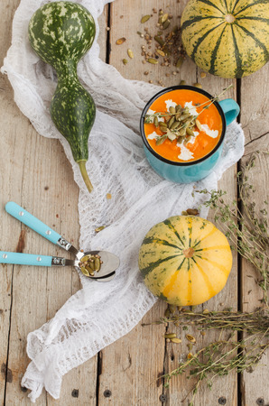 Pumpkin soup with pumpkin seeds in a cupの写真素材