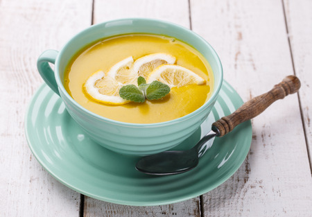 Puree soup with red lentils, with mint and lemon wedges.Traditional Turkish cuisine.の写真素材