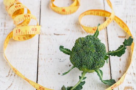 green broccoli on wood tableの写真素材