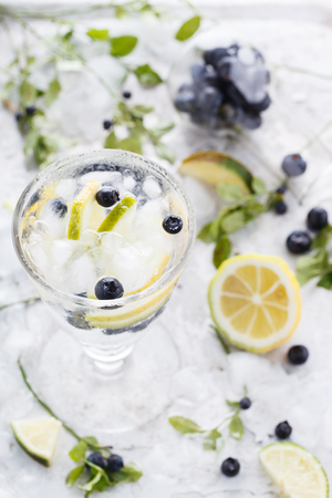 Detox water cocktail, blueberry, lime, lemon and ice. selective focusの写真素材