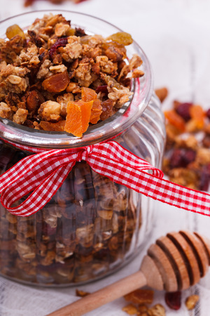 Granola from several types of cereals with nuts,honey,raisinsの写真素材