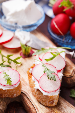Bruschetta with radishes, feta cheese and arugula.selective focusの写真素材