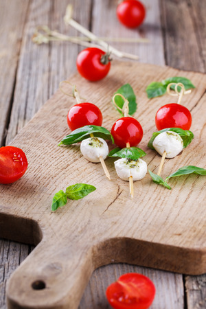 Cherry tomatoes,mozzarella and Basil on skewers. Appetizer,Caprese.の写真素材