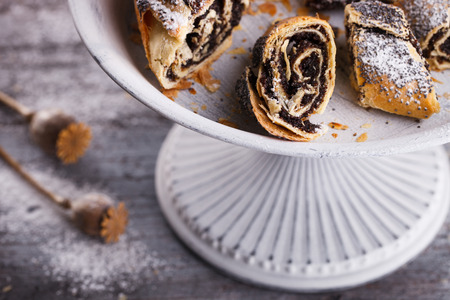 Strudel with poppy seeds on a vintage stand.selective focus.の写真素材