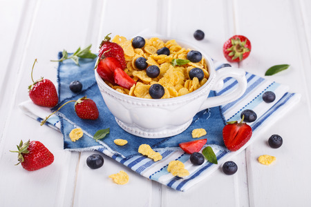 Corn flakes and fresh berries, for Breakfast. selective focusの写真素材