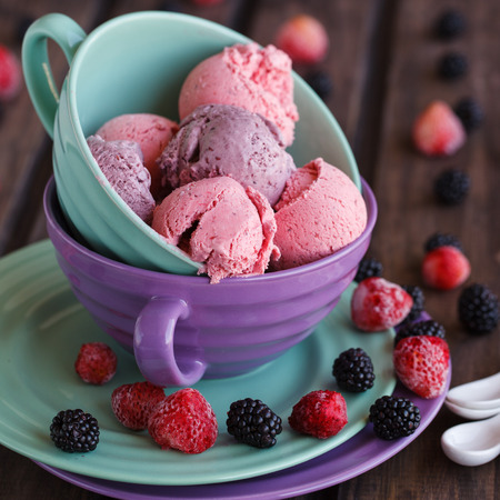 Ice cream BlackBerry and strawberry in the shape of a ball, with fresh berries.selective focusの写真素材