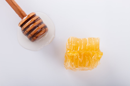 Honey dipper on a white background. selective focus.の写真素材