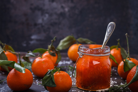 Tangerine jam in a glass jar.A traditional dessert at Christmas and New year.の写真素材