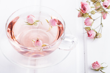 Tea with rose petals in a glass Cup. Rose water.の写真素材