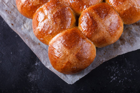Easter Hot Cross Buns on a dark background