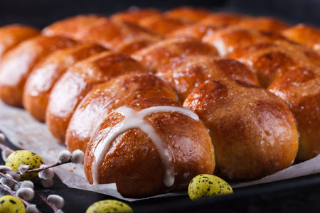 Easter Hot Cross Buns on a dark background