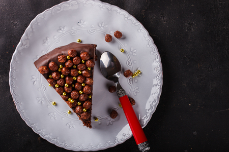 Piece of chocolate cake  on a dark background.の写真素材