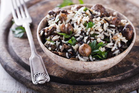 Salad of white and wild rice with mushrooms and herbs.selective focus.の写真素材