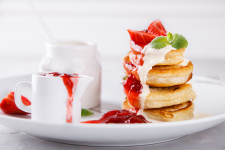 Pancakes with strawberry jam. Breakfast. Selective focus.の写真素材