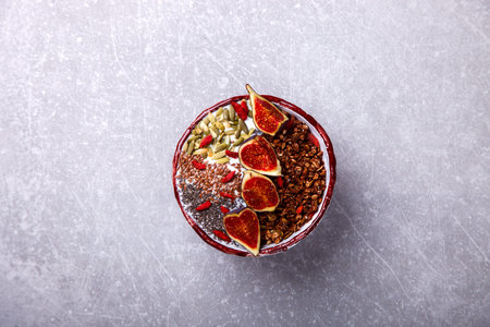 Granola with yogurt, Chia seeds,Goji berries,pumpkin seeds, fresh figs and honey.A vegetarian...