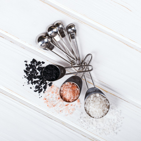 Measuring spoons on white Background. A classic spice for cooking. top view. Copy space. selective focus.の写真素材