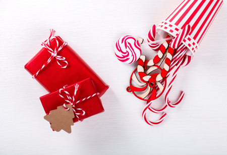 Christmas gifts,Traditional Holiday Candy in the form of a Cane in a red Cup on a White background.