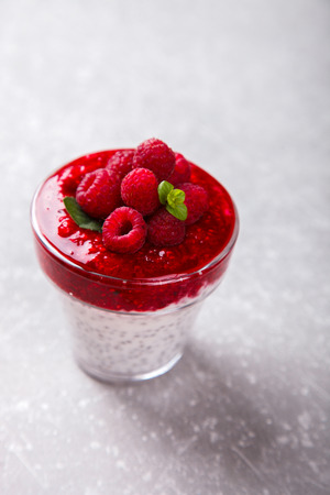 Yogurt with Fresh Raspberries and Chia seeds and mint.Concept Of A Healthy Breakfast.selective focus.の写真素材