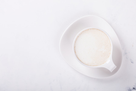 White Coffee Cup with Milk on a light Background.Copy space. selective focus.の写真素材