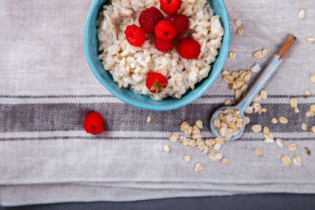 Oatmeal Porridge with fresh Berries,Raspberry.Breakfast.Concept of Healthy Eating. Copy space.selective focus.の写真素材