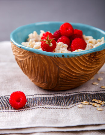 Oatmeal Porridge with fresh Berries,Raspberry.Breakfast.Concept of Healthy Eating. Copy space.selective focus.の写真素材