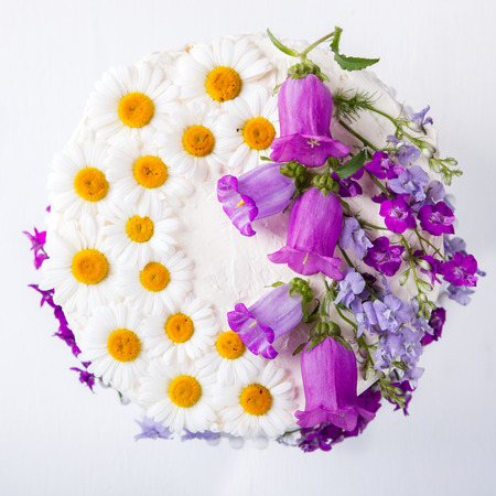 Cake Festive  with Cream decorated with fresh Flowers.selective focus.の写真素材